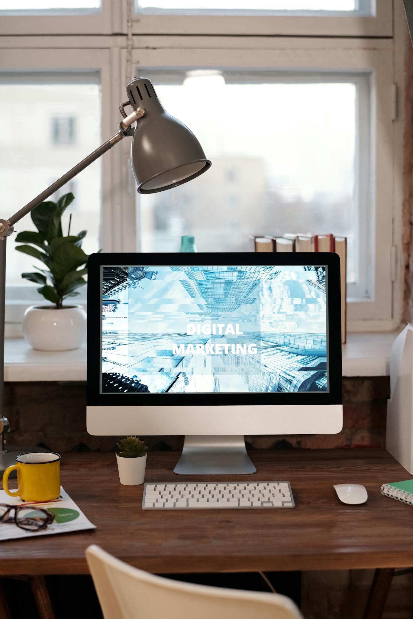 Silver Imac on Brown Wooden Table